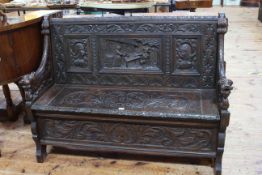 Victorian heavily carved oak box hall bench, 93cm high by 127cm wide by 45cm deep.