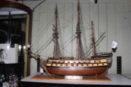 Carved wood galleon depicting Nuestra Senora, 110cm length.