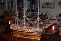 Wooden galleon on stand depicting Montane, length 120cm.