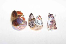 Three Royal Crown Derby paperweights including cat, hen and cockerel.