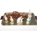 Six Beswick Beatrix Potter figures with boxes and stand.