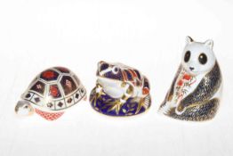 Three Royal Crown Derby paperweights including tortoise, panda and frog.