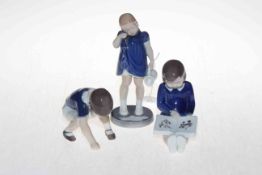 Three Royal Copenhagen child figures including boy playing marbles.