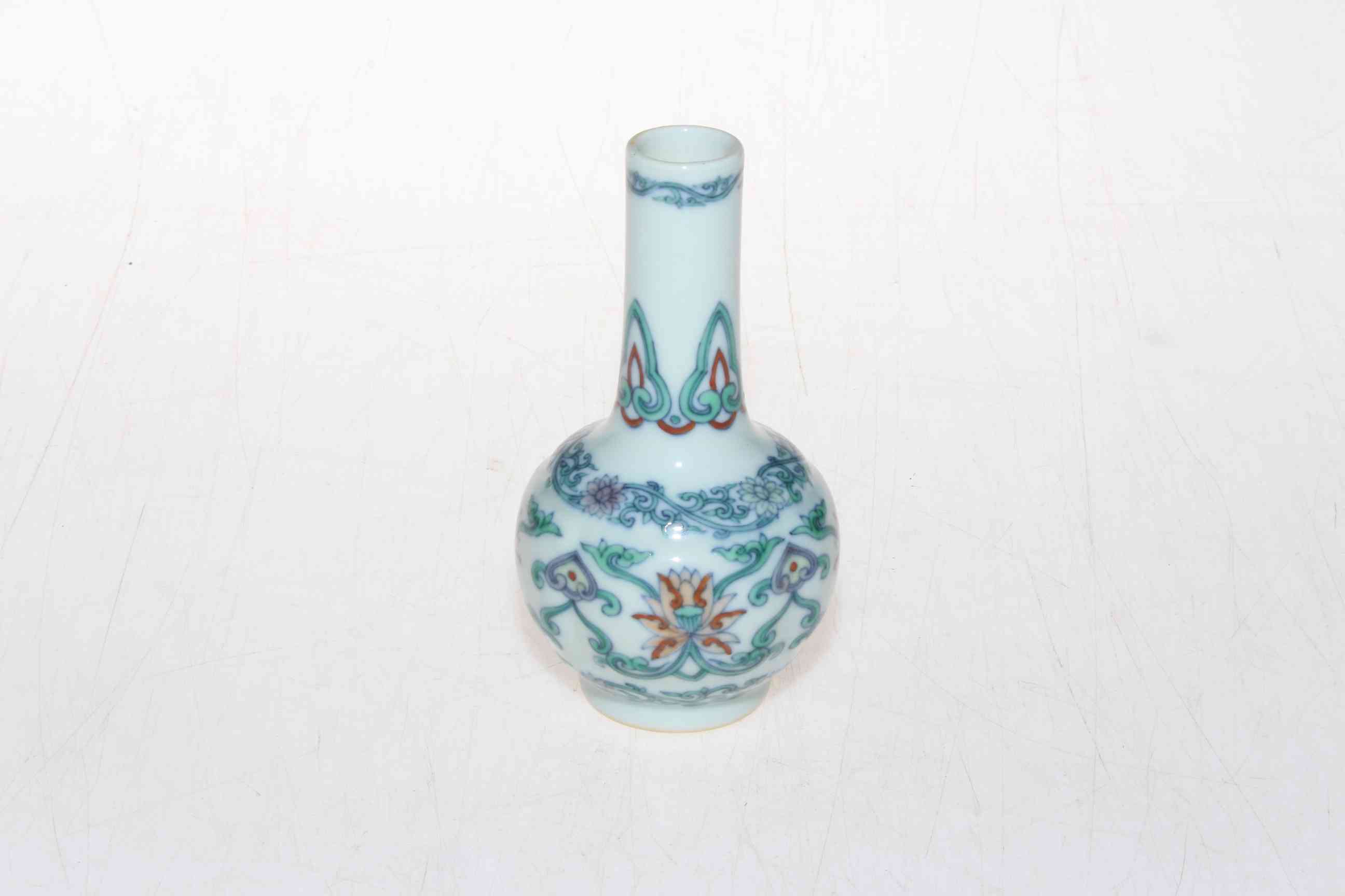 Small Chinese bottle vase with stylised decoration, six character mark, 11.5cm.