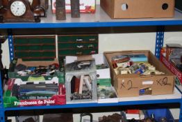 Full shelf of toys including model vehicles, airplanes, Star War toys, model railway, doll, etc.