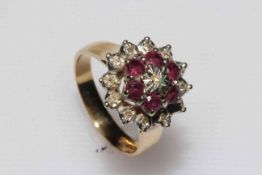 Ruby and diamond cluster 9 carat gold ring, size P.