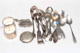 Collection of silver teaspoons, tongs, two napkin rings, decanter label, etc.