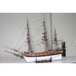 Carved wood galleon depicting HMS Fly, 80cm length.