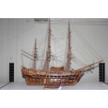 Carved wood galleon depicting HMS Bounty, 90cm length.