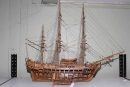 Carved wood galleon depicting HMS Bounty, 90cm length.