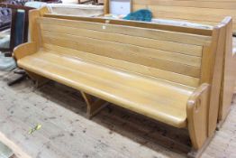 Pair of oak church pews, 222cm long.