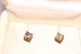 Pair 18 carat gold and diamond stud earrings.