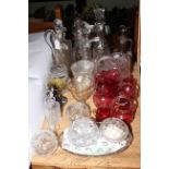 Collection of glasswares including ruby glass, decanters and ewers, powder bowls, vases, etc.