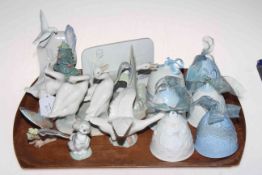 Collection of fourteen Lladro pieces including six bells, butterfly, swans and name plaques.