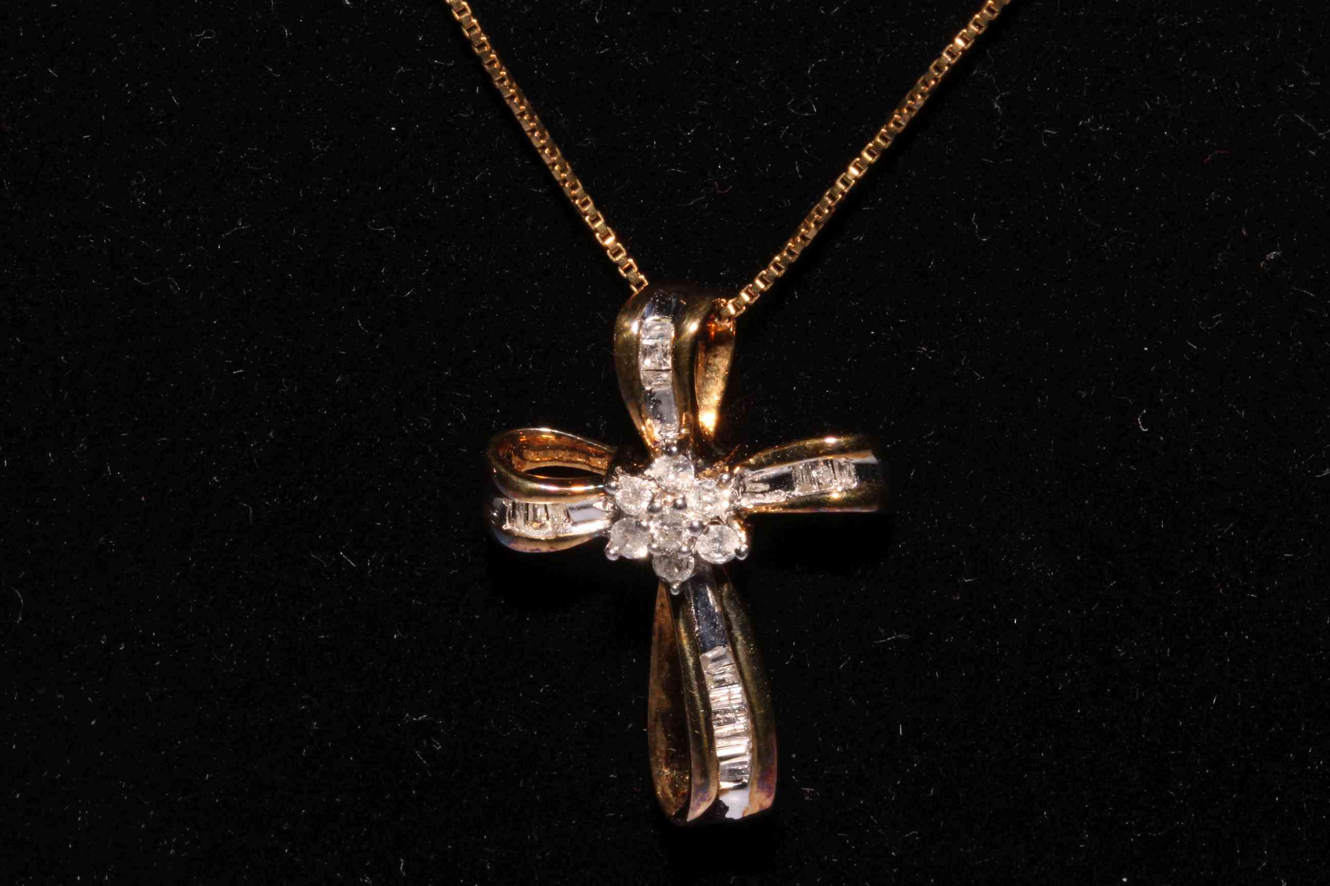Silver gilt diamond set cross pendant and chain.