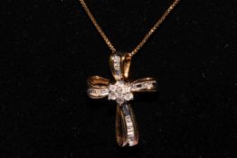 Silver gilt diamond set cross pendant and chain.