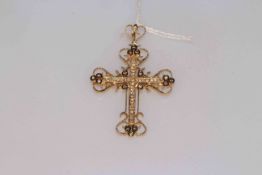 14k gold and ornate diamond set cross pendant.