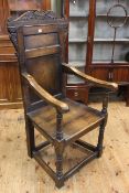 Antique oak Wainscot chair with panel back raised on turned legs to understretchers,