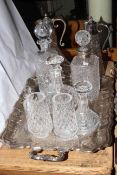 Silver plated tea tray, two EP mounted claret jugs, four crystal decanters,