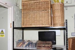 Toshiba digital television, books, 78rpm records, and two wicker baskets.