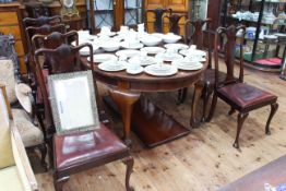 Large mahogany oval extending dining table with two leaves and set of eight Queen Anne style dining