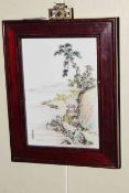 Small Chinese porcelain plaque depicting lake edge and cliffs, signed bottom left.