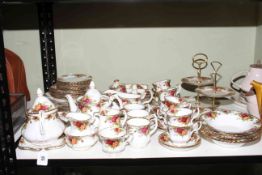 Royal Albert Country Roses service comprising seventy pieces and including two cake stands.