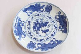 Chinese blue and white saucer dish, decorated with children and dragon border, 29cm diameter.