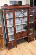 Edwardian mahogany breakfront vitrine,