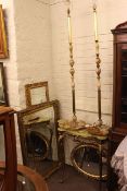 Onyx and gilt metal hall table and two similar standard lamps and three gilt framed wall mirrors.