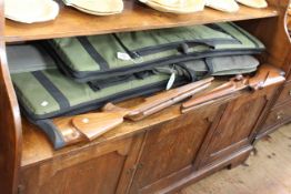 Three gun cases and two rifle stocks.