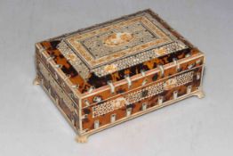 Ivory and tortoiseshell decorated casket on paw feet, 22cm wide.