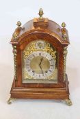 Oak and gilt metal mounted bracket clock on scroll feet, 40cm.