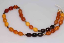 W. Hammond, Whitby, amber bead necklace, 44cm long.