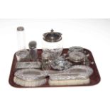 Silver wares comprising embossed brush set, seven silver topped toilet bottle, bon bon dish,