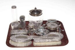 Silver wares comprising embossed brush set, seven silver topped toilet bottle, bon bon dish,