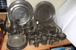 Large collection of antique pewter comprising five chargers, seventeen plates, warmer,