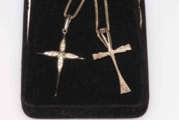 Two silver cross pendant with chains.