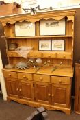 Pine kitchen dresser, stained pine kitchen table and six chairs (4+2).