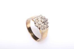 18 carat gold and diamond cluster ring.