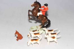 Beswick Huntsman on rearing horse with six hounds and fox.
