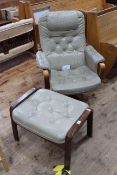 Vintage button leather swivel chair and footstool.