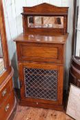 Late Victorian rosewood music cabinet with mirror back above fall front and single leaded glass