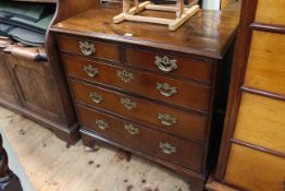Georgian mahogany four height chest of neat proportions raised on bracket feet with brass drop