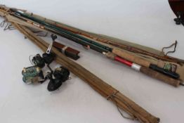 Collection of fly fishing rods and three reels.
