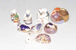 Collection of nine Royal Crown Derby paperweights.