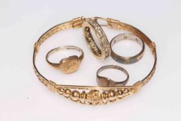 14k gold eternity ring, three silver rings, and gilt bangle (5).