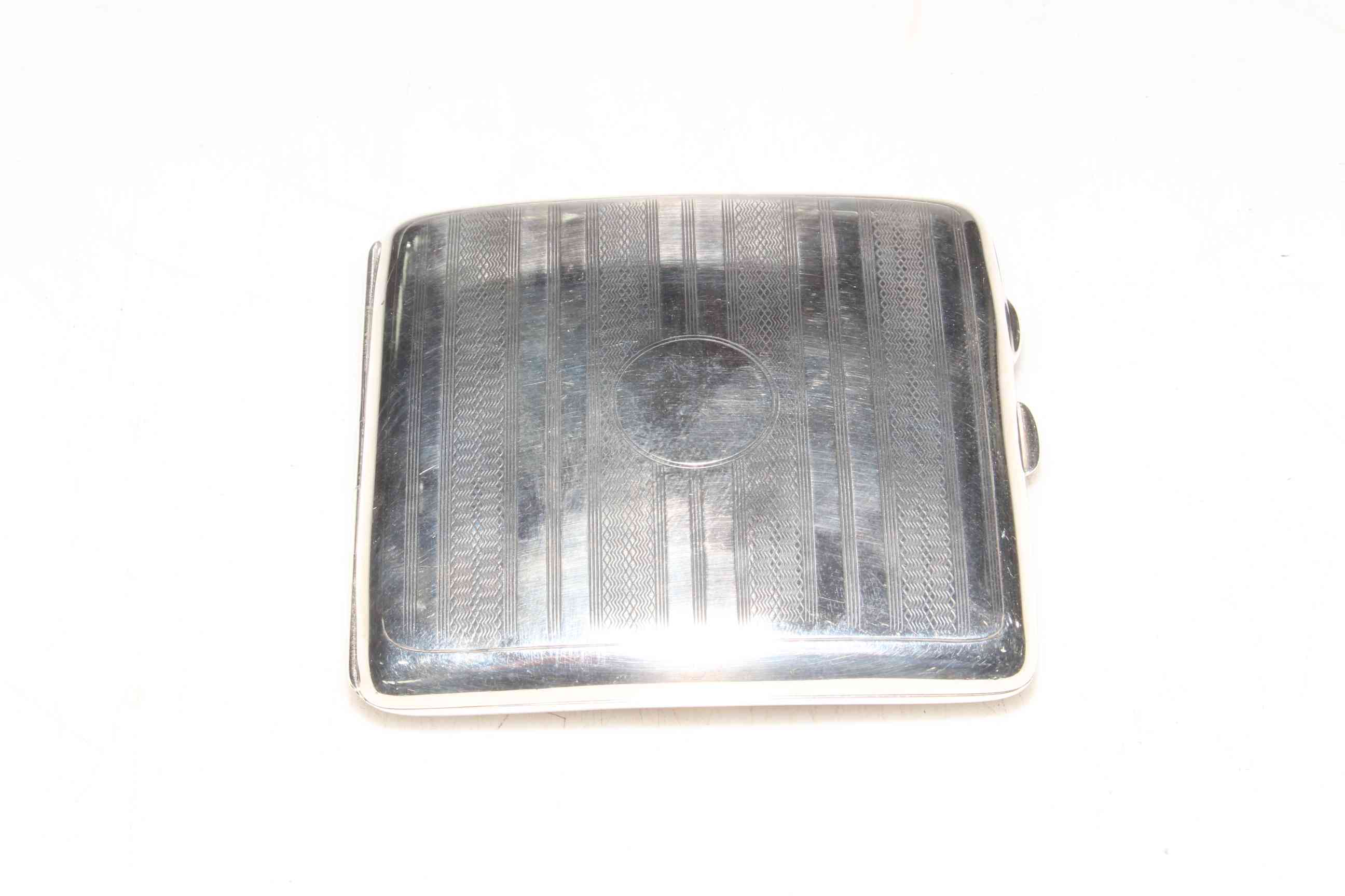 Silver cigarette case.