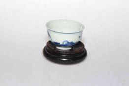 Chinese blue and white tea bowl with six character mark to base, 7.5cm diameter, with stand.