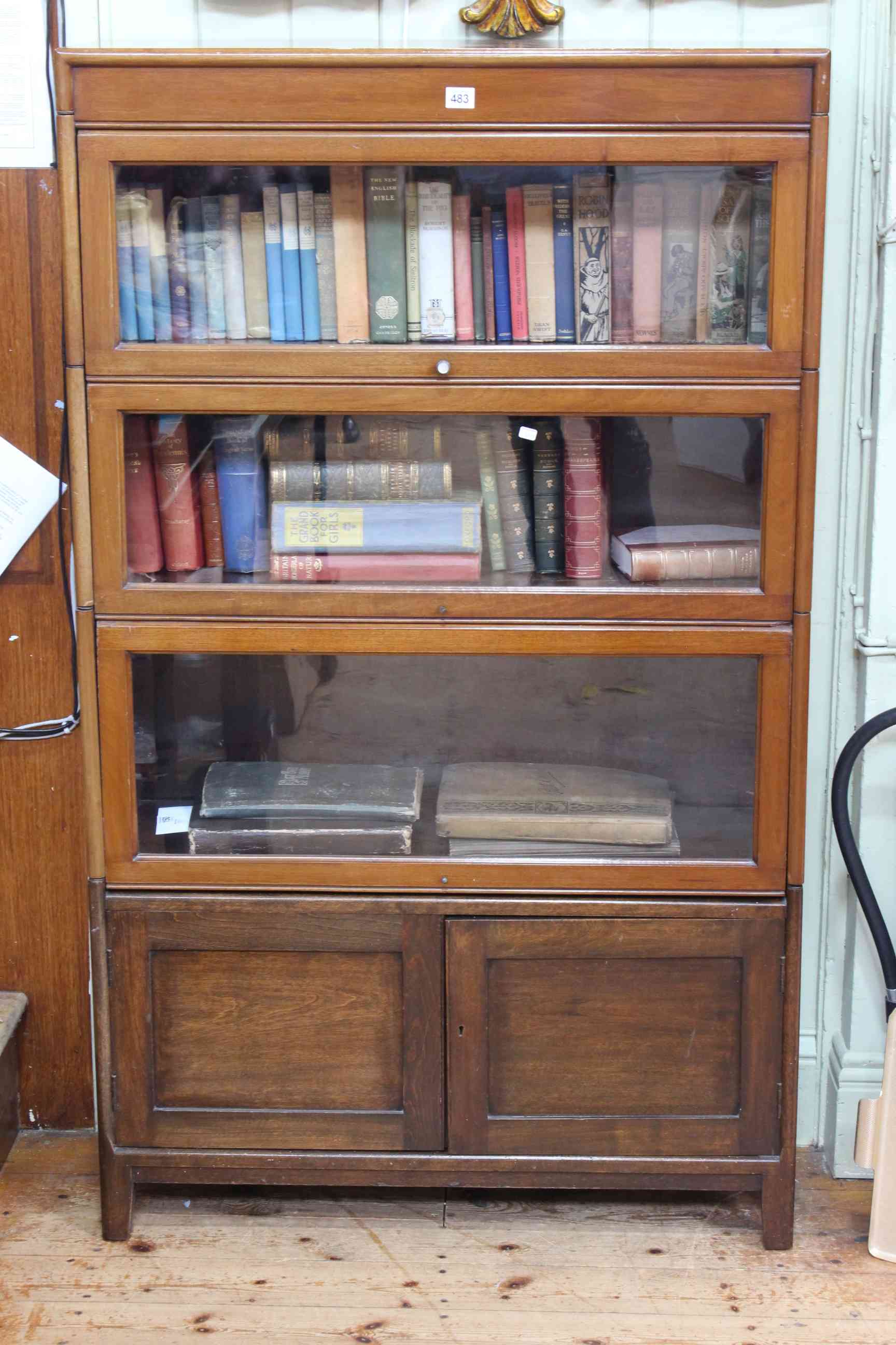 Mahogany stacking bookcase having three glazed doors above two cupboard doors, 146.